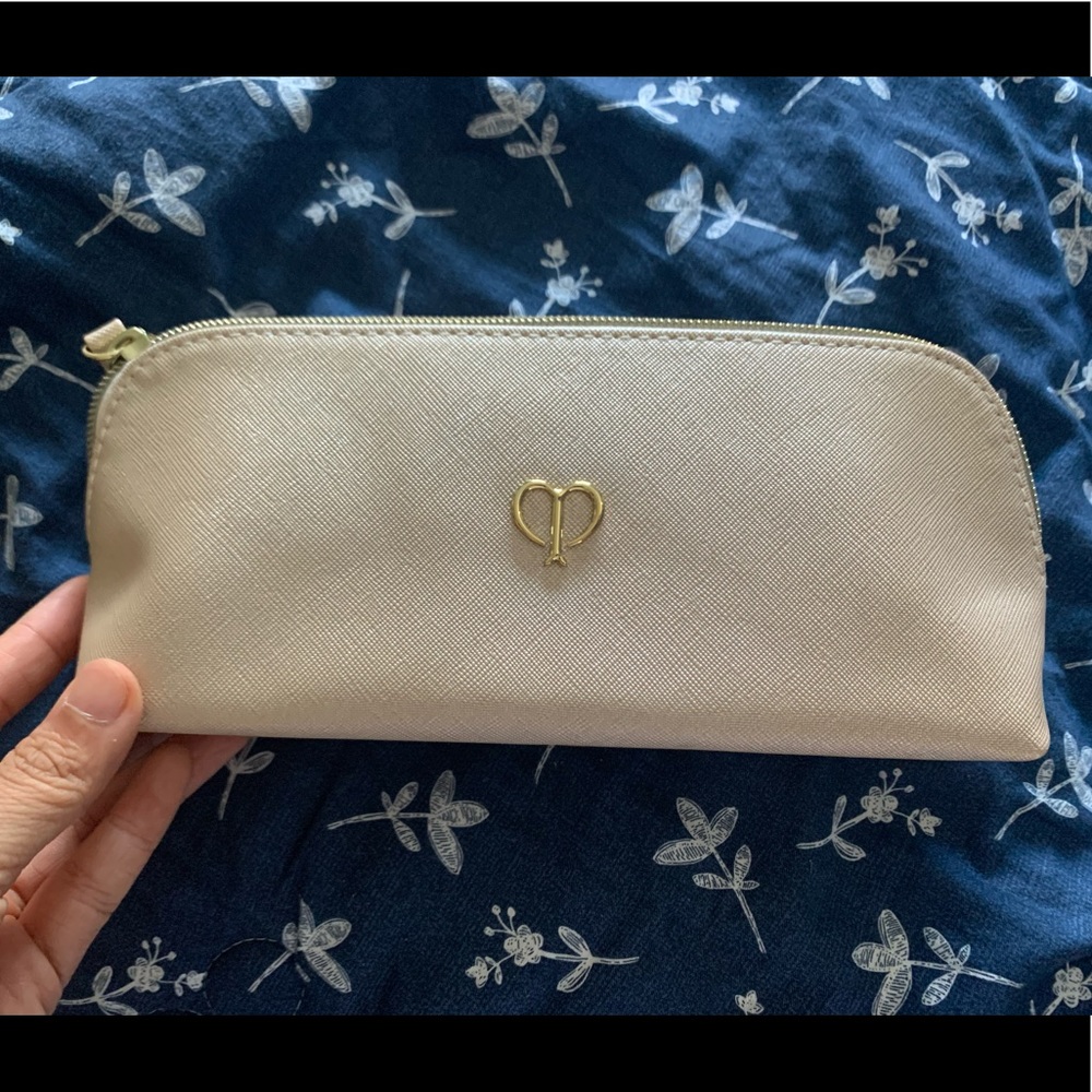New Cle De Peau makeup bag in shiny cream color